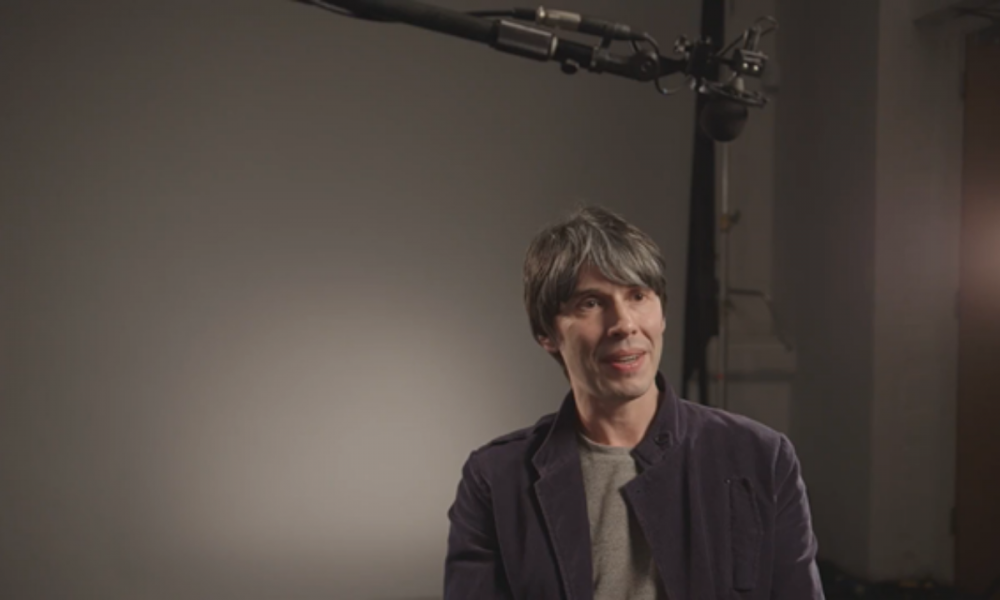 Brian Cox having an interview with a camera crew.